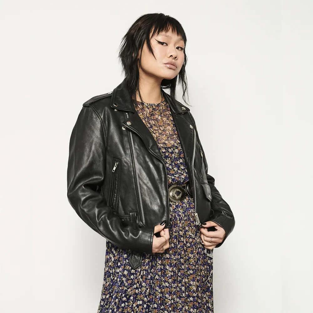 Woman wearing Imogen Leather Jacket, hands in pockets, front view, sleek design