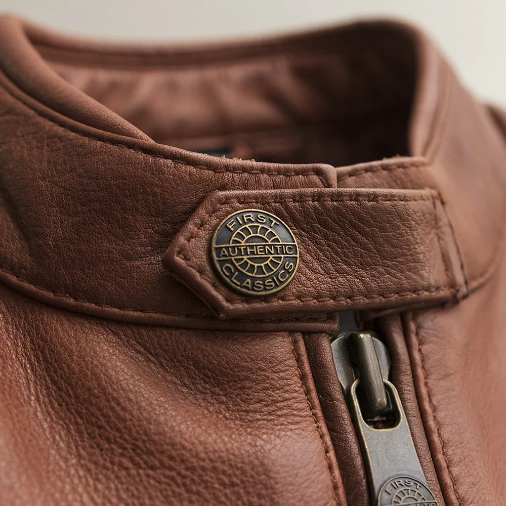 Close-up of collar on Crusader Men's Leather Jacket in whiskey, emphasizing texture and style.