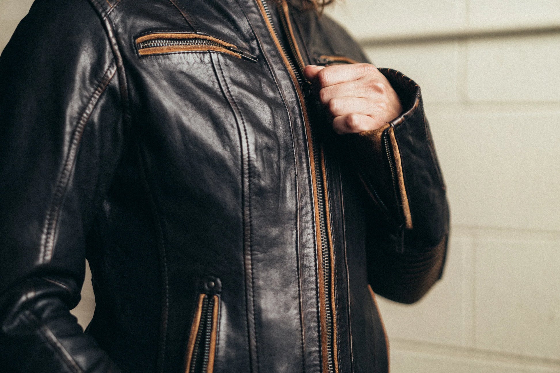 Woman wearing Electra Leather Motorcycle Jacket, front view showcasing the fit and style on her figure.