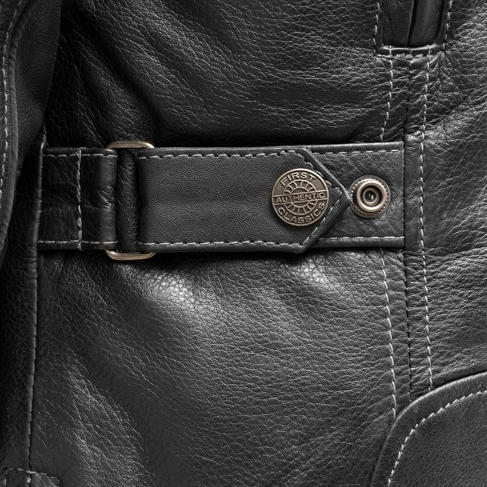 "Close-up of the side buckle detail on the Free Spirit women's black leather jacket, showcasing snap-down side tabs at the natural waist for adjustable fit."