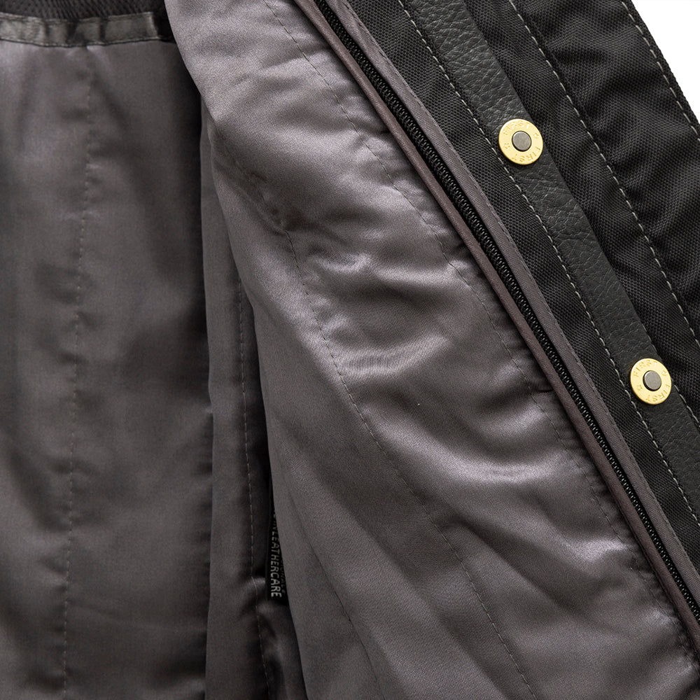  "Front view of the Free Spirit women's black leather jacket partially open, highlighting the snap-down collar, exposed center zipper, and visible snap closures."